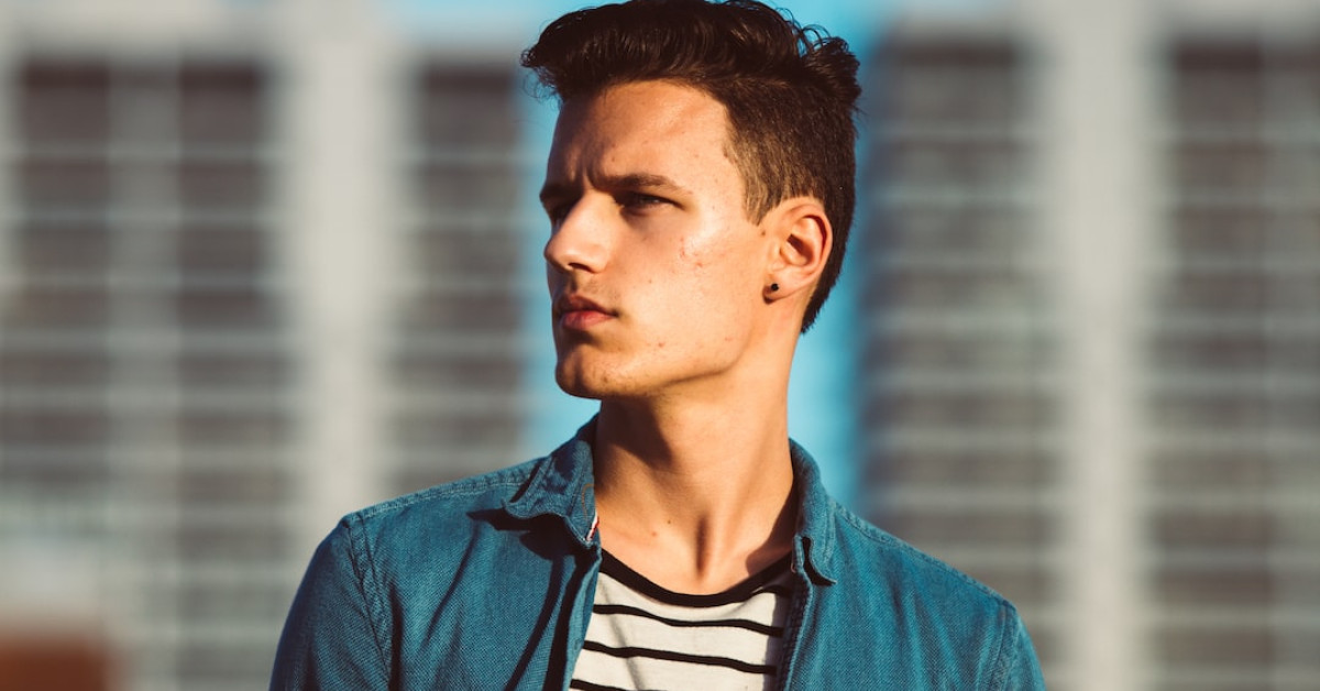 Man sporting trendy short haircut for stylish modern look.