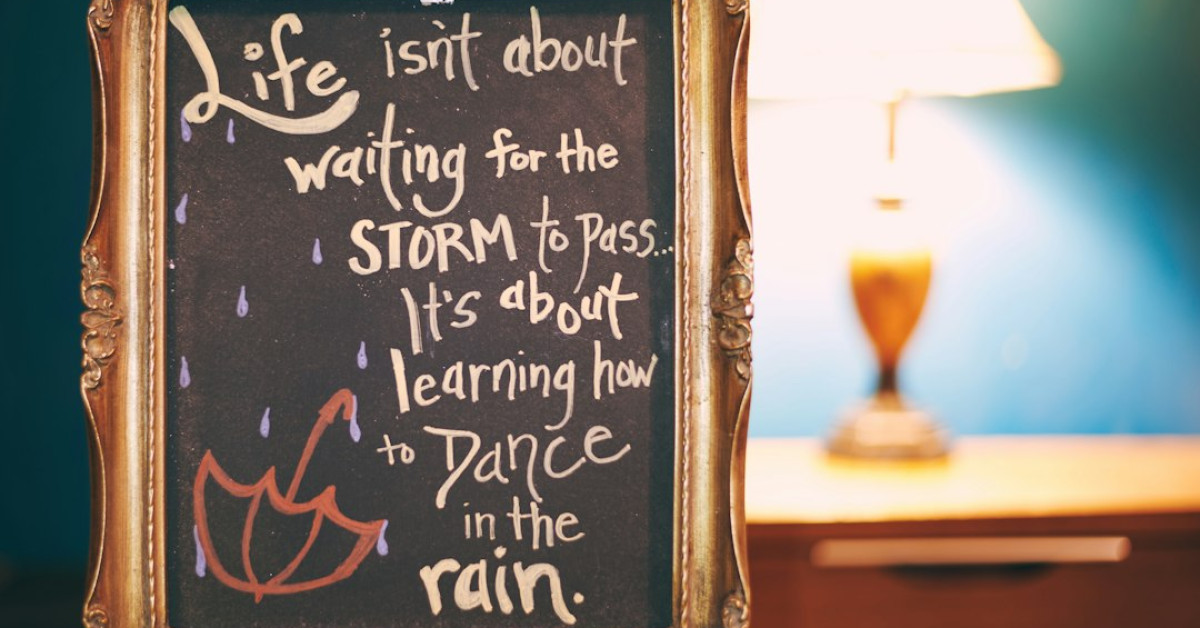 Inspirational life quotes overlay on calming nature background.