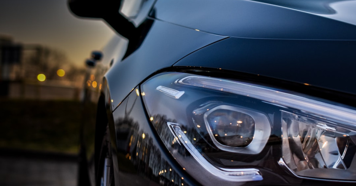 Model Y Performance headlights shining on dark road.