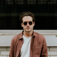 Man showcasing top short curly hairstyle for a trendy look. Man showcasing top short curly hairstyle for a trendy look.