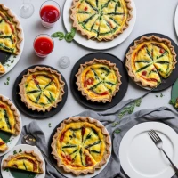 Vegetable Florentine quiche on a plate for brunch. Vegetable Florentine quiche on a plate for brunch.
