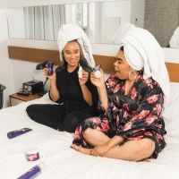 Applying tanning lotion for a perfect sun-kissed glow. Applying tanning lotion for a perfect sun-kissed glow.