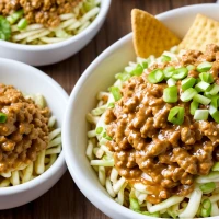 Big Mac salad in a bowl with fresh ingredients. Big Mac salad in a bowl with fresh ingredients.