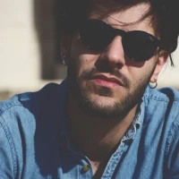 Fresh broccoli on soil illustrating its agricultural origins. Fresh broccoli on soil illustrating its agricultural origins.