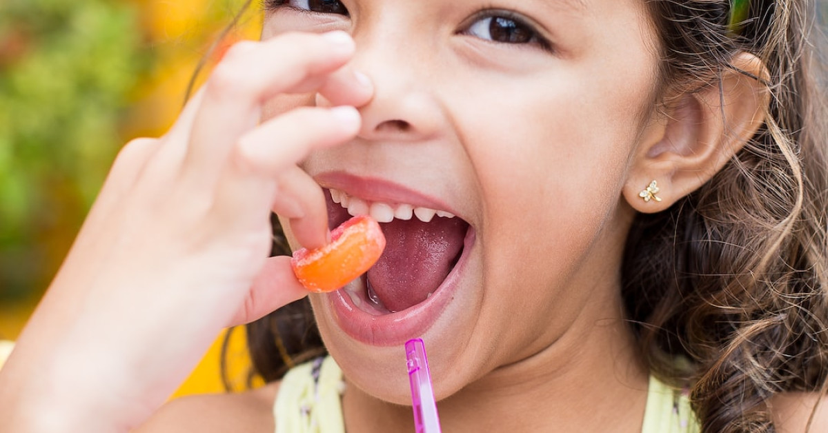 Chickens pecking at scattered blueberries