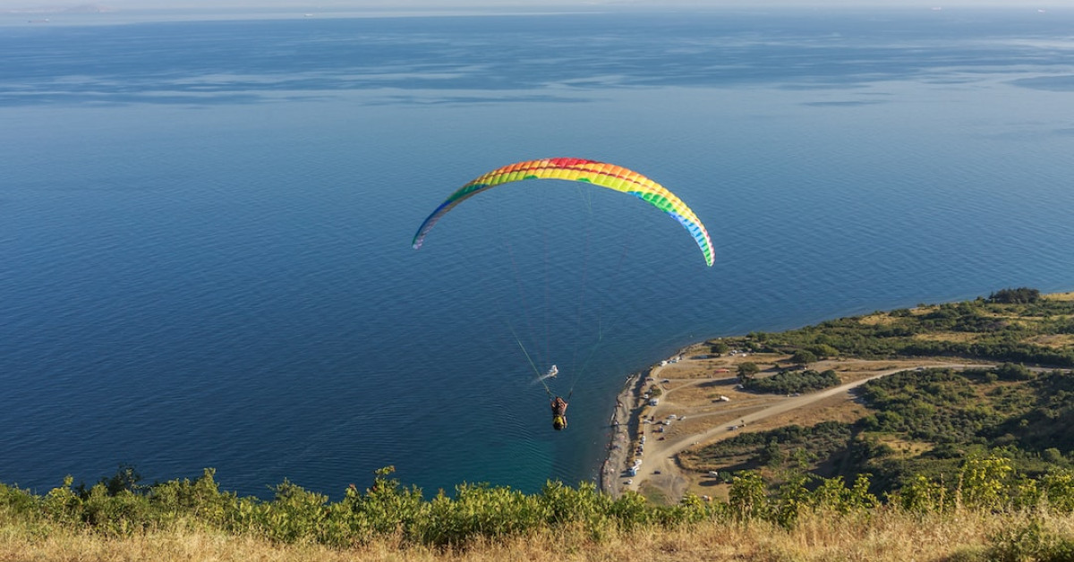 Anniversary couple adding photo to 'Our Adventure Book' album