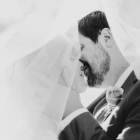 Couple embracing, text overlay with anniversary messages for husband. Couple embracing, text overlay with anniversary messages for husband.