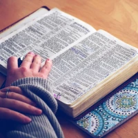 Couple celebrating anniversary with Bible verses backdrop. Couple celebrating anniversary with Bible verses backdrop.