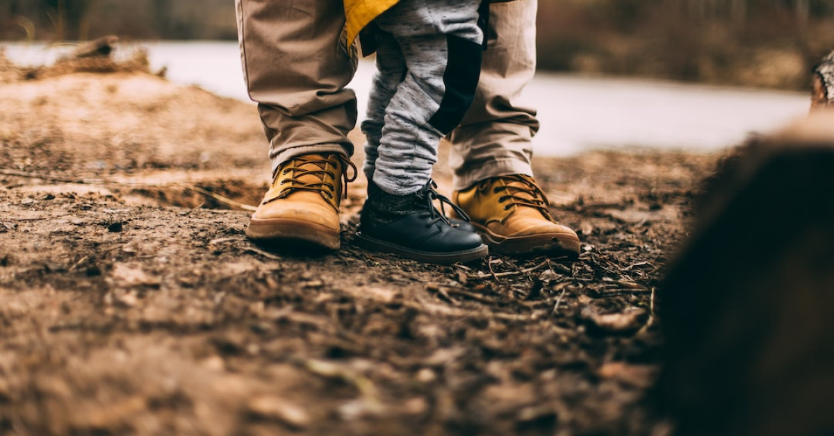 Chase Stokes posing for a photoshoot, looking contemplative.