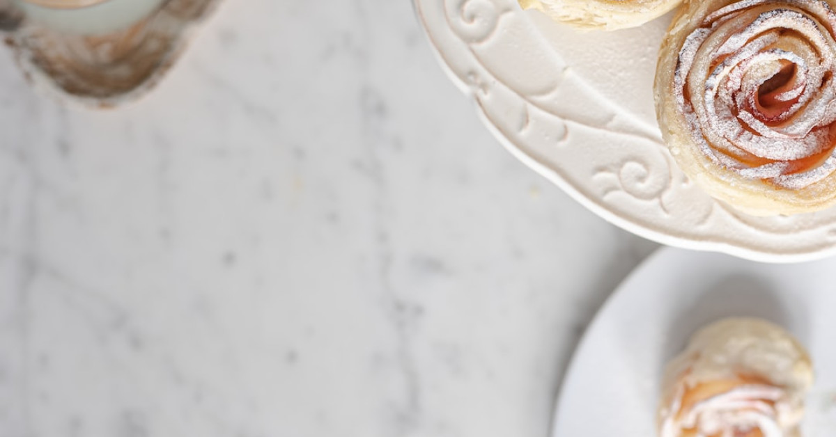 Cinnamon rose wedding theme with elegant groom's attire details.