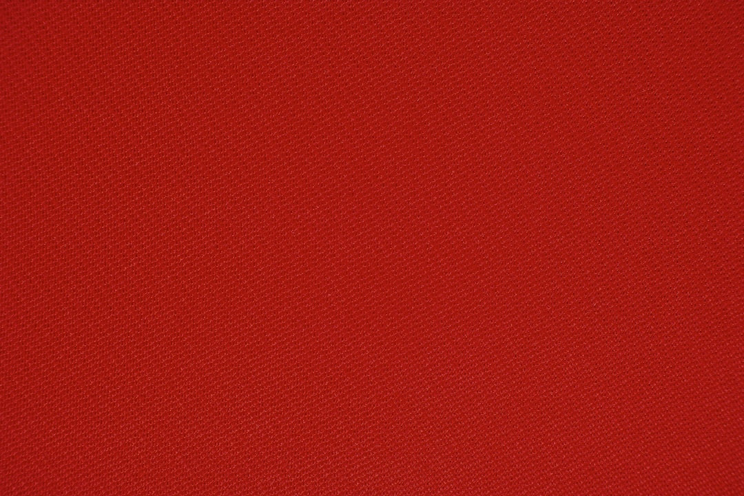 Stylish red hiking boots on rugged trail.