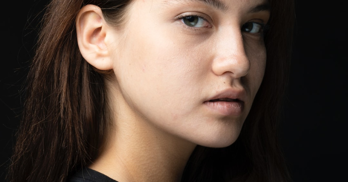 Daredevil cliff diver leaps from towering peak into sea.