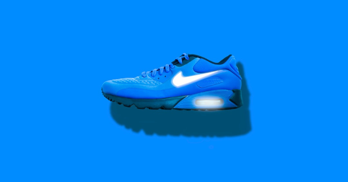 Man hiking in mountains wearing Terrex Free Hiker shoes