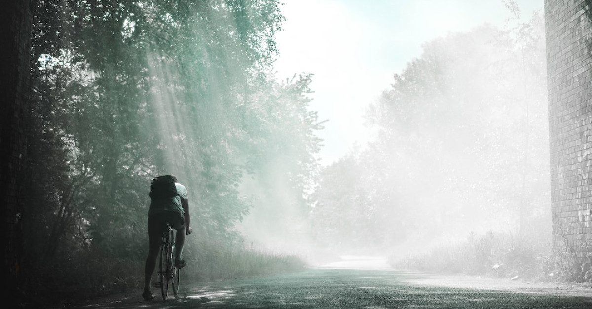 Women cycling for fitness and weight loss outdoors.