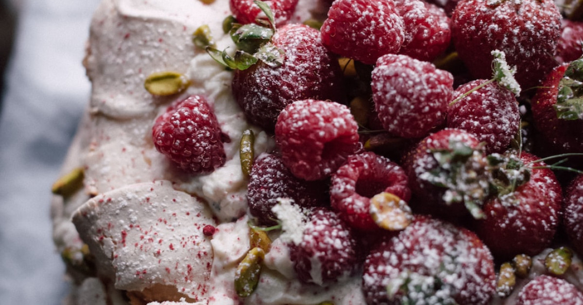 Icebox cake slice with graham crackers on plate.