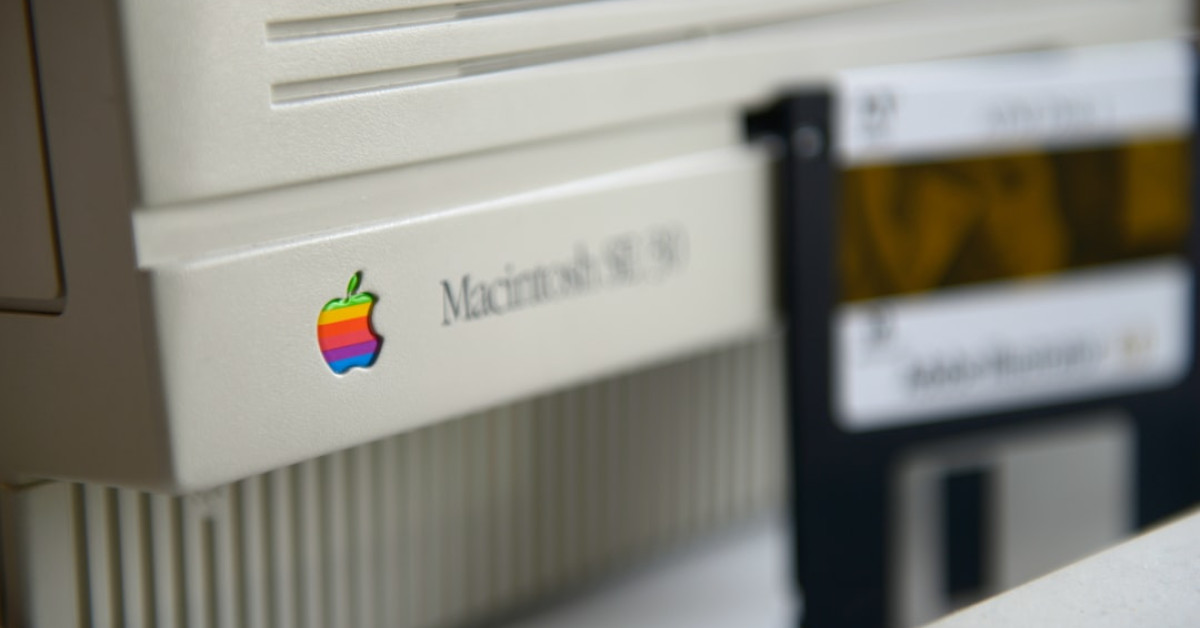 Dutch oven mac and cheese preparation on wooden table.