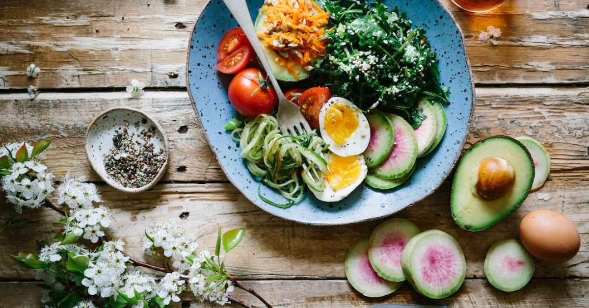 Assorted fresh Costco salad bowls on a table.