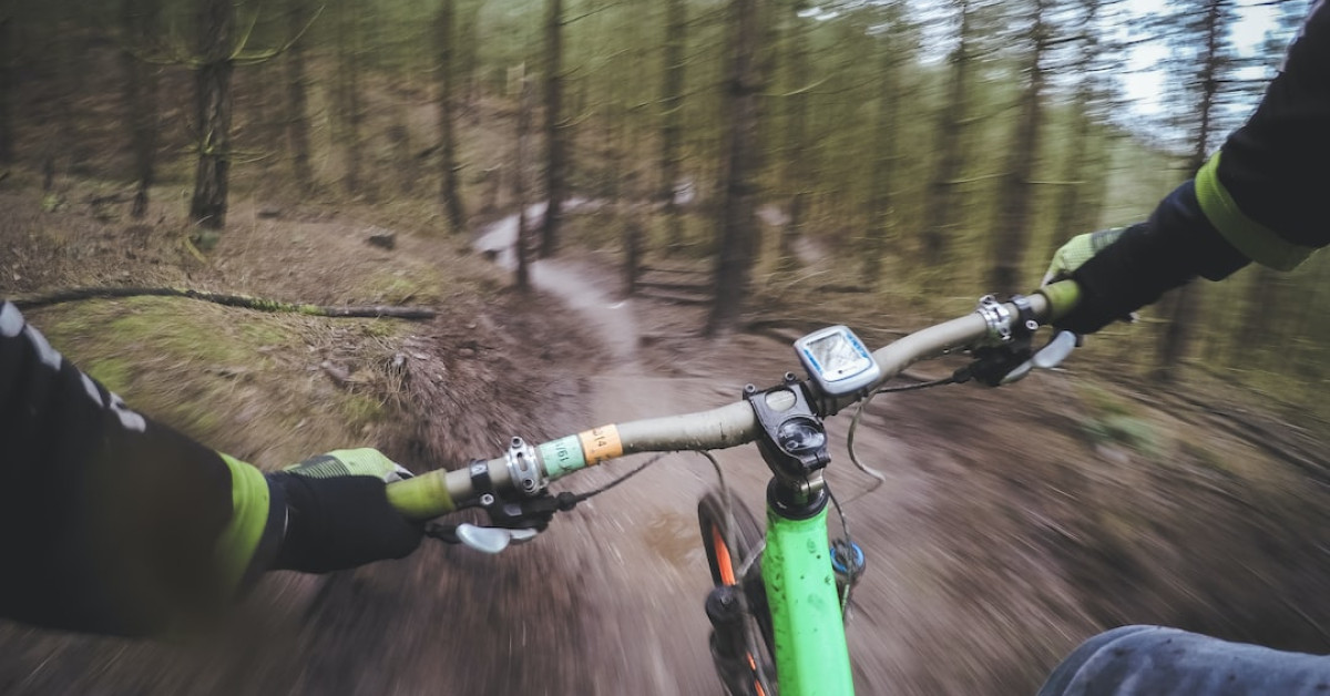 Man cycling in British countryside for health and lifestyle.