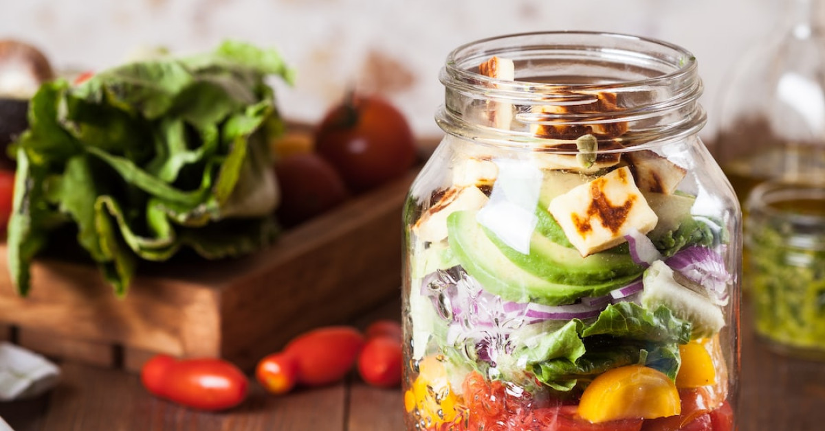 Panera Broccoli Cheddar Soup in a bowl with bread.