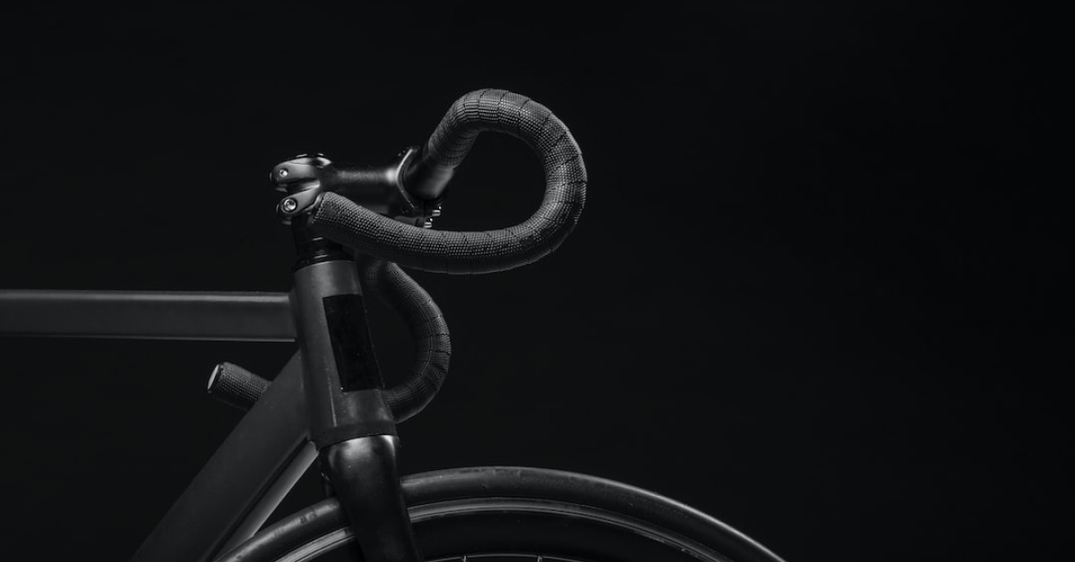 Cyclist applying grease for smooth bike maintenance.