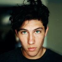 Diver exploring split-level underwater and above-water landscape. Diver exploring split-level underwater and above-water landscape.