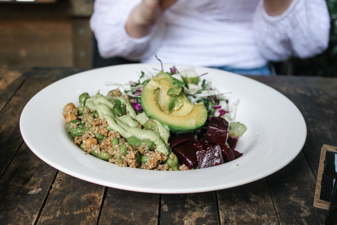 Healthy quinoa bowl with fresh vegetables and grains.