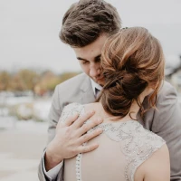 Curvy bride in elegant, well-fitted wedding gown. Curvy bride in elegant, well-fitted wedding gown.