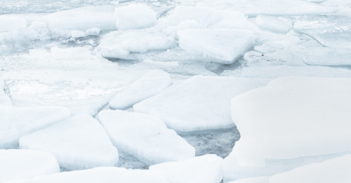 Blueberry pancakes topped with syrup on a chic brunch table.