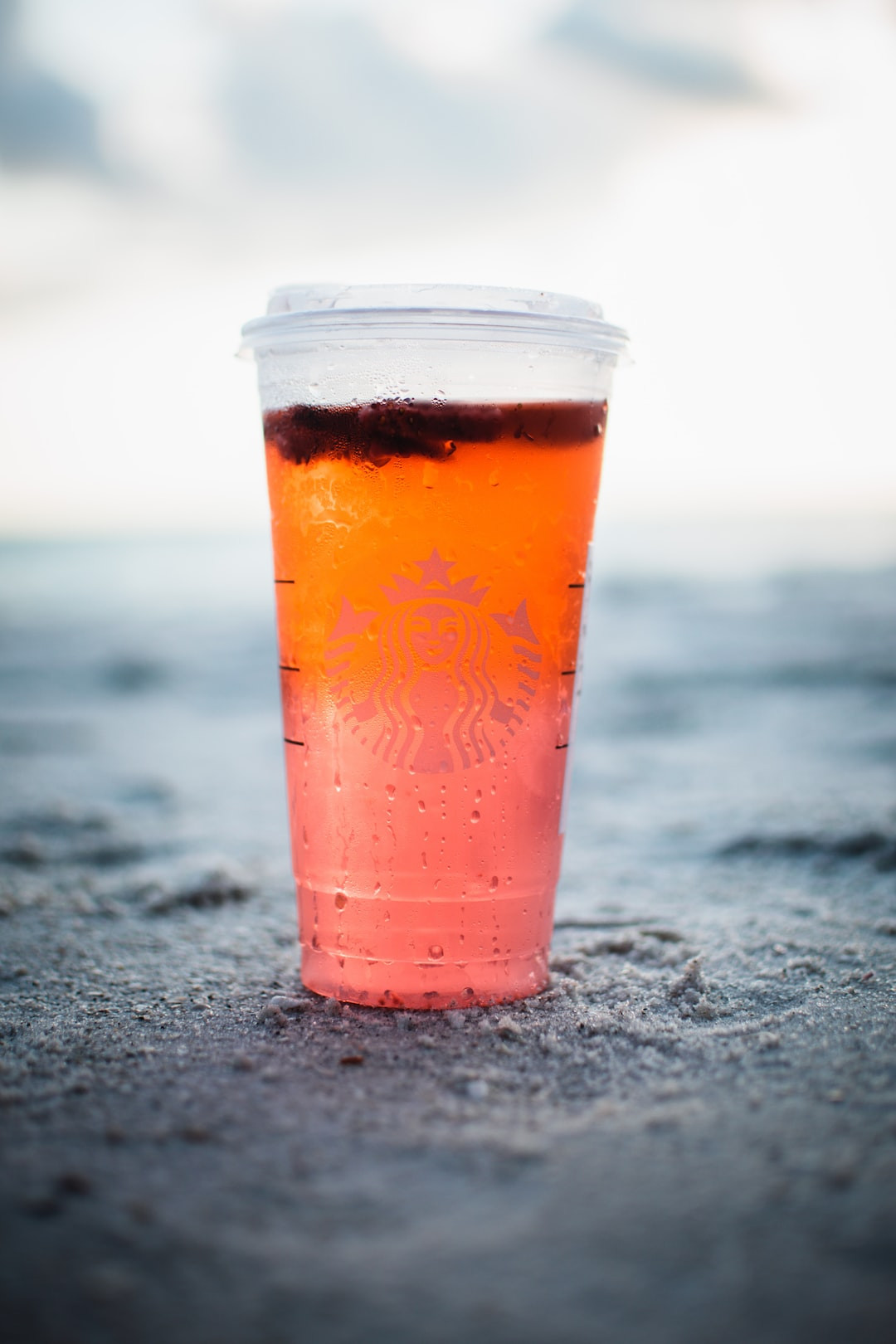 Starbucks cup on table enhancing coffee experience.