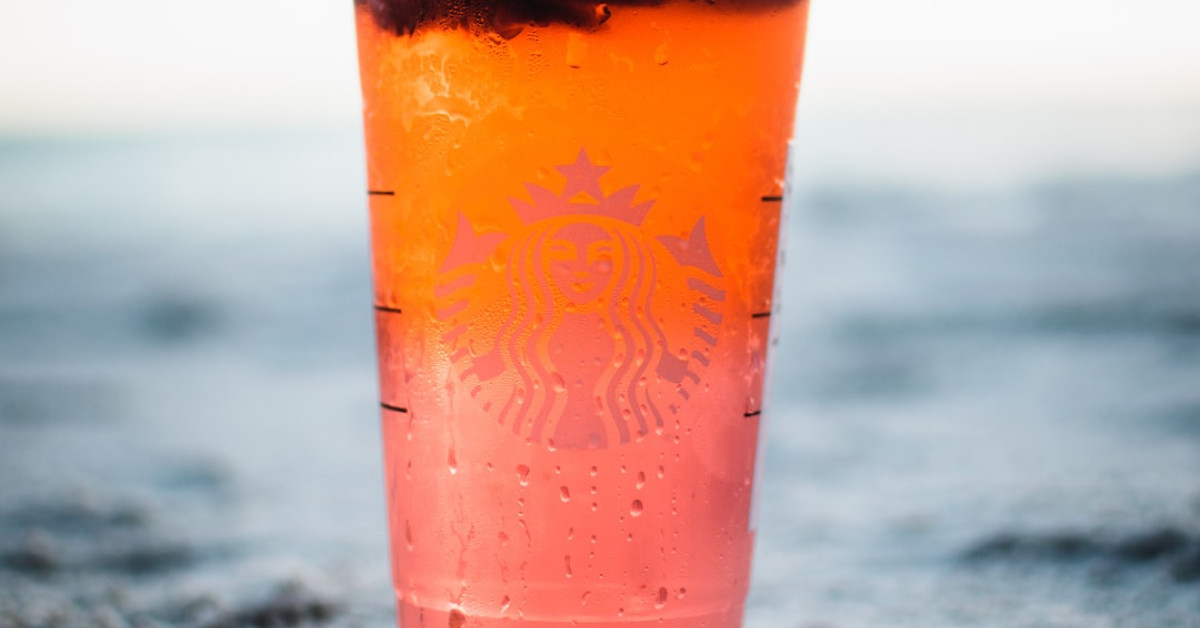 Starbucks cup on table enhancing coffee experience.