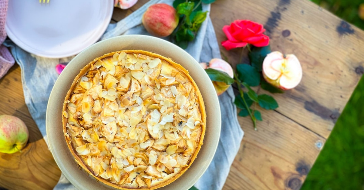 Savory shortbread pie crust with fresh vegetables on top.