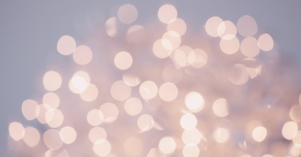 Groom in pink and green attire for wedding.