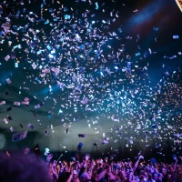 Group celebrating 18th anniversary with excitement and confetti. Group celebrating 18th anniversary with excitement and confetti.