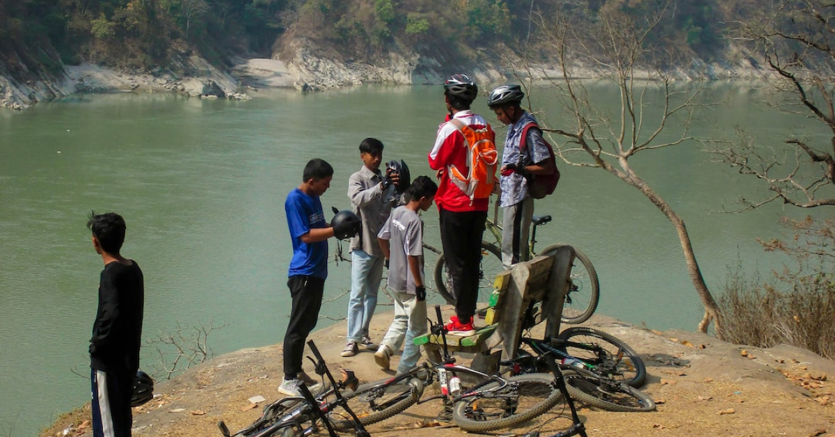 Person cycling in nature for health and transformation.