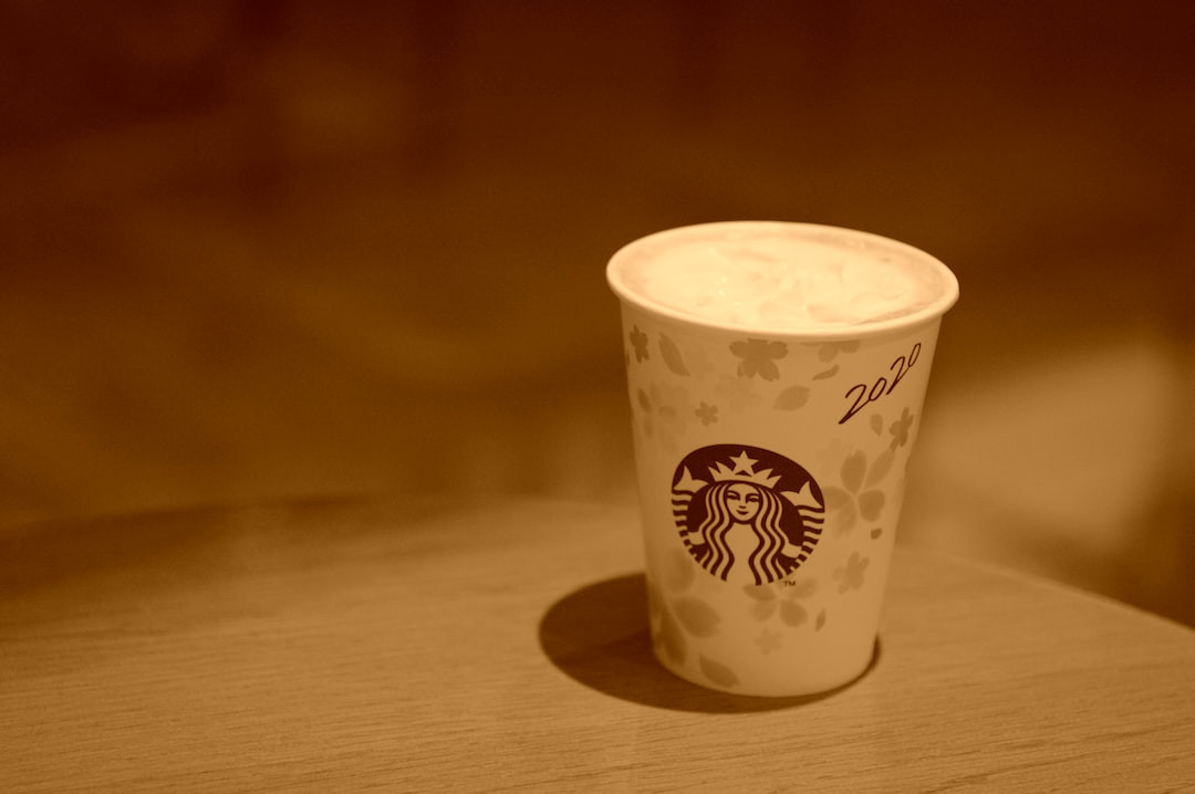 Japanese Starbucks cups with intricate designs on display.