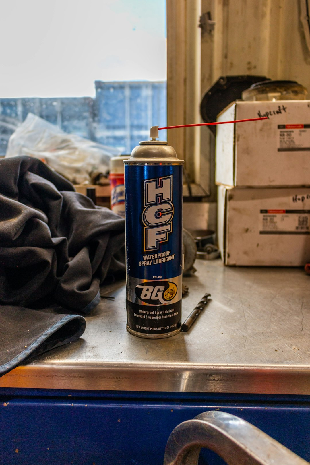 Chickens pecking broccoli in a feeding frenzy on a farm.