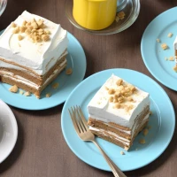 Graham cracker icebox cake with fresh vegetable garnishing. Graham cracker icebox cake with fresh vegetable garnishing.