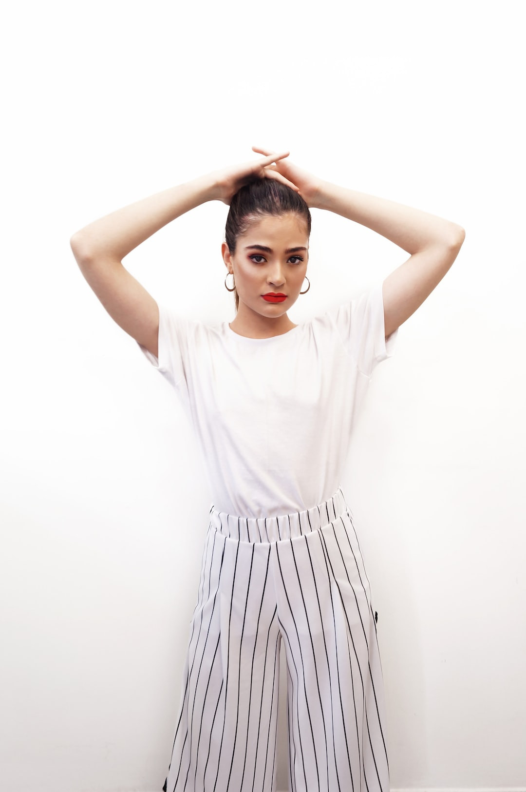 Laurence Bédard, tattooed model posing for a photoshoot.