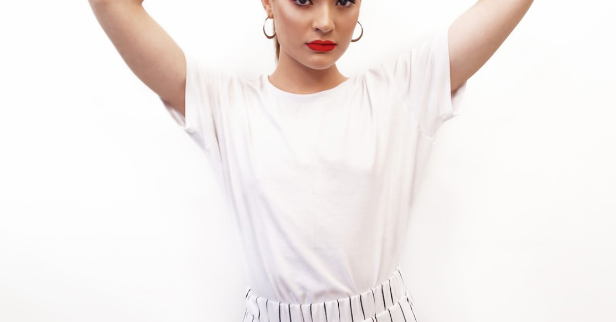 Laurence Bédard, tattooed model posing for a photoshoot.