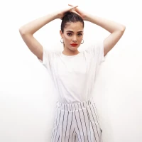 Laurence Bédard, tattooed model posing for a photoshoot. Laurence Bédard, tattooed model posing for a photoshoot.