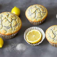 Lemon poppy seed muffins on white plate Lemon poppy seed muffins on white plate