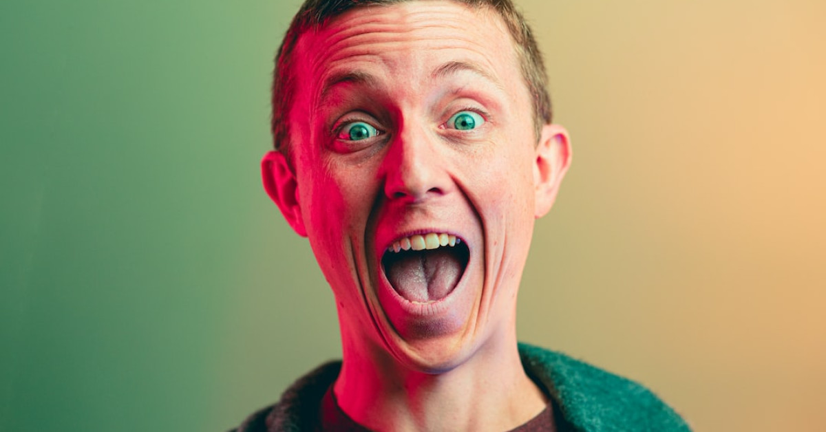 Kevin Hart laughing during stand-up comedy performance