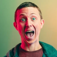 Kevin Hart laughing during stand-up comedy performance Kevin Hart laughing during stand-up comedy performance