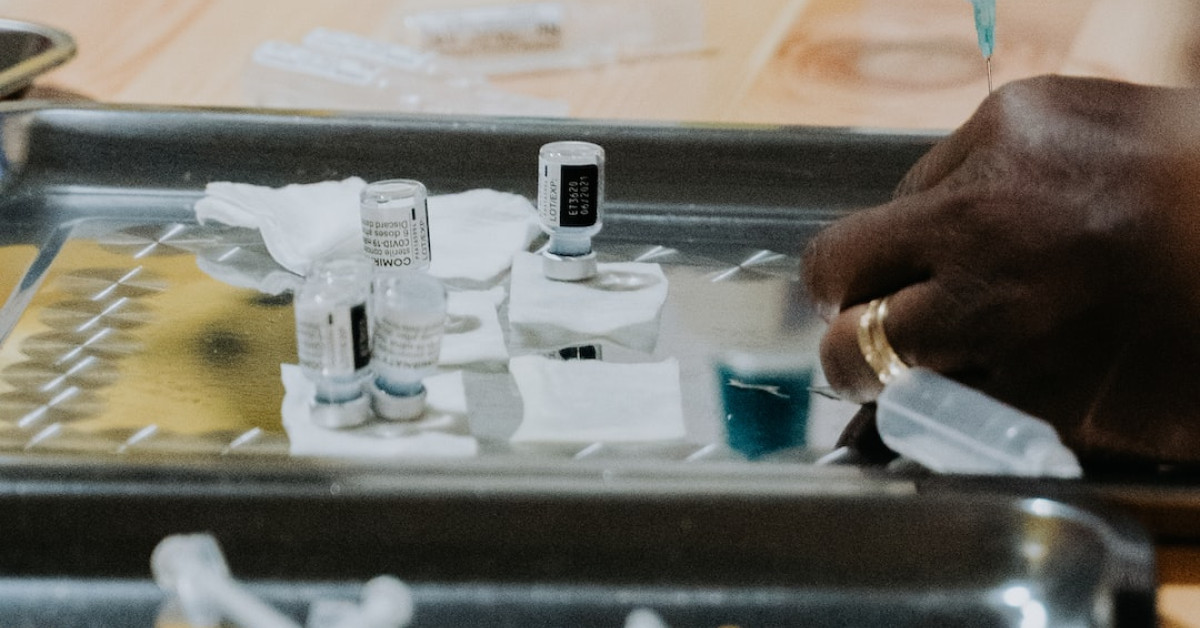Cyclist inflating tire with presta valve for efficient riding.