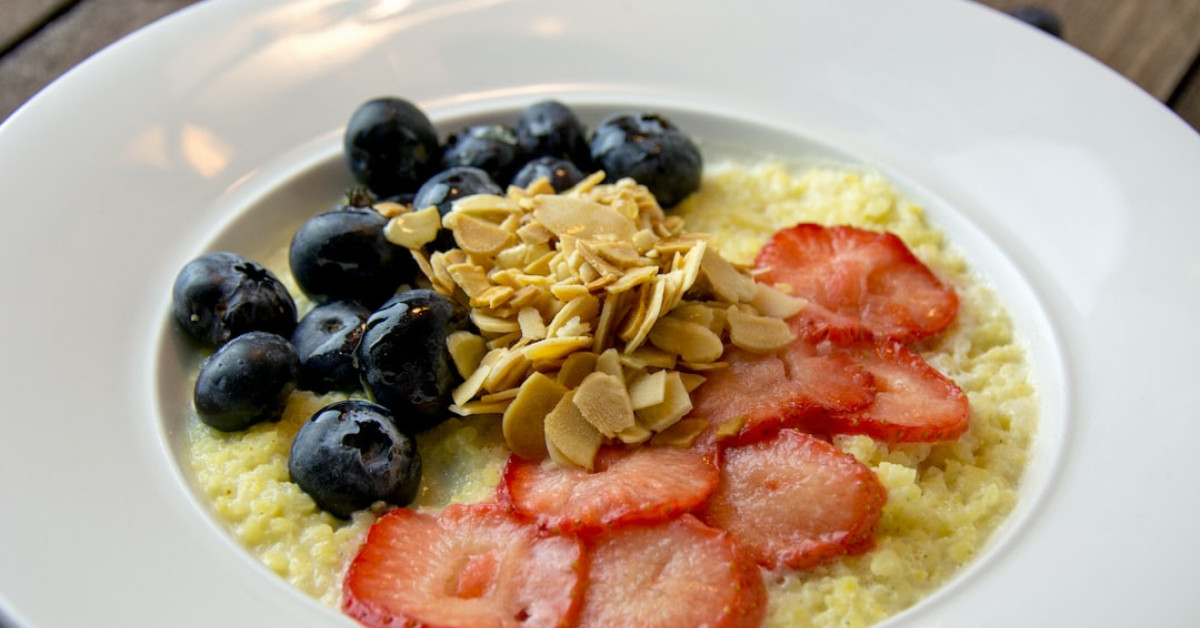 Fresh homemade strawberry jam in jars with labels.