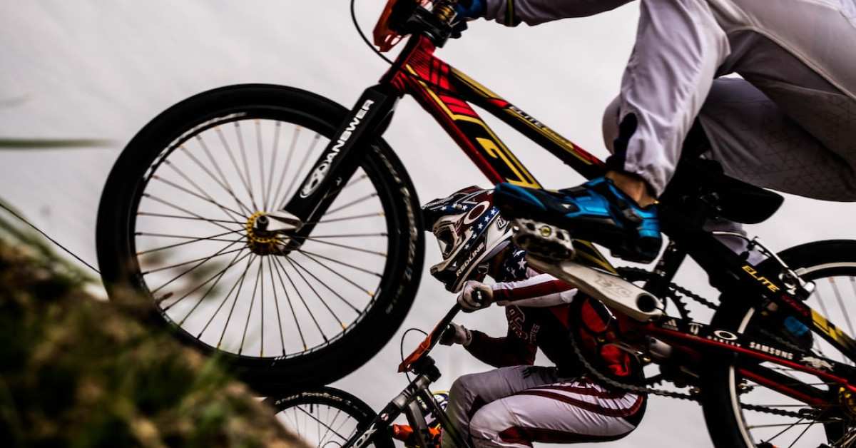 Pro cyclist mastering hill climb during intense training session.