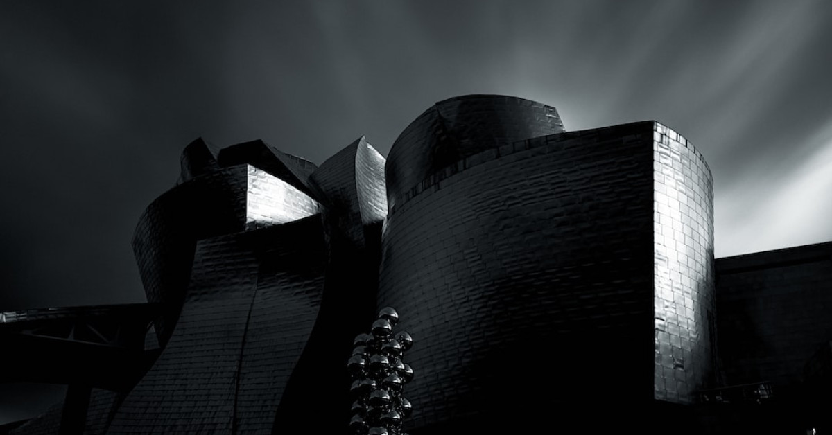 Miles William Guggenheim, Elisabeth Shue's son, smiling outdoors.