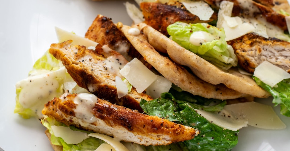 Naan vs Pita bread comparison on wooden board