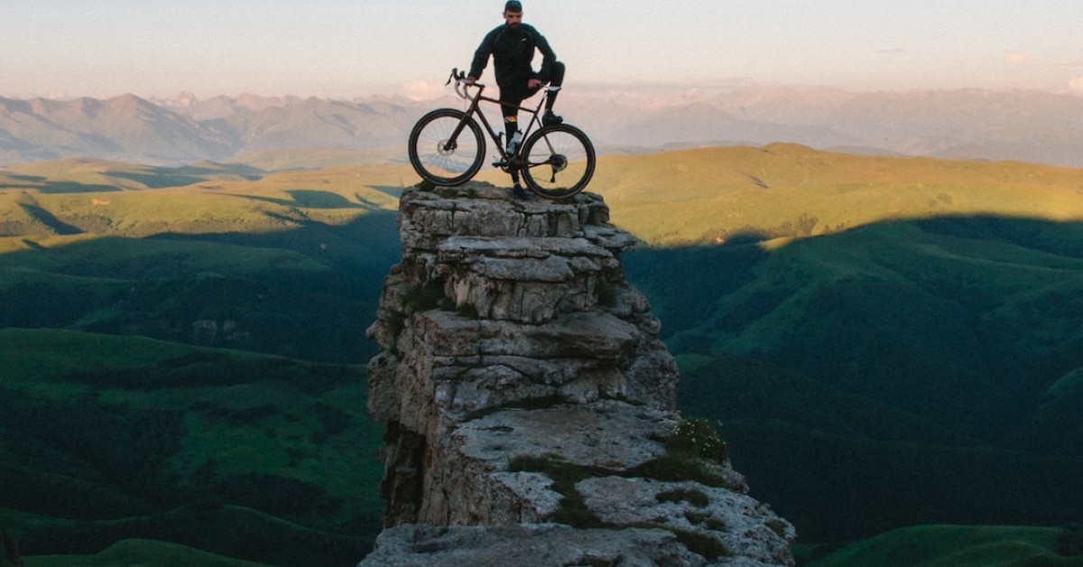 Man cycling intensely, highlighting fitness benefits of biking.