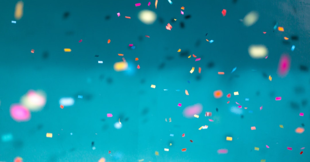 Elegant pink and blue wedding groom's attire guide.